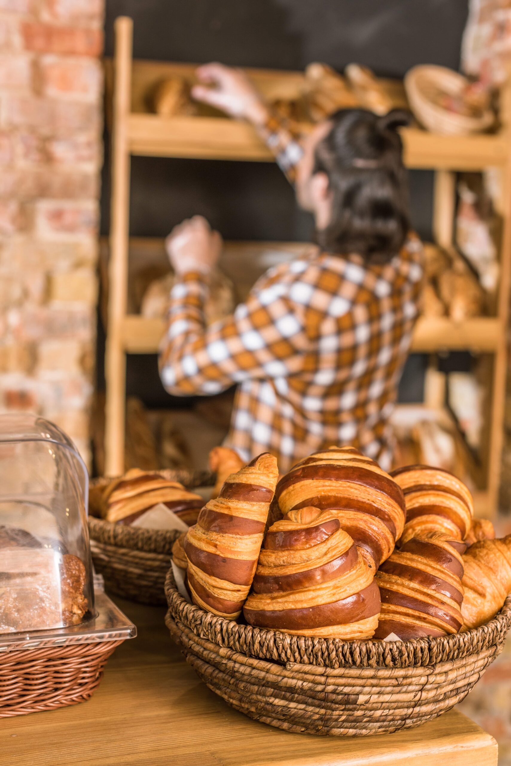 close-up-of-freshly-baked-pastry-in-wicker-basket-2023-11-27-05-18-59-utc-min